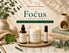 Focus Collection by Nurse Calm Aromatherapy featuring the Sensaytional handcrafted soy candle, Focus Fuel Atmosphere Mist, and Focus Fuel Essential Oil Roller in a spa-inspired wellness display for mental clarity and concentration.