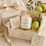 Gift set with candle, card, and fruit in a box labeled 'Nurse Calm Aromatherapy'.