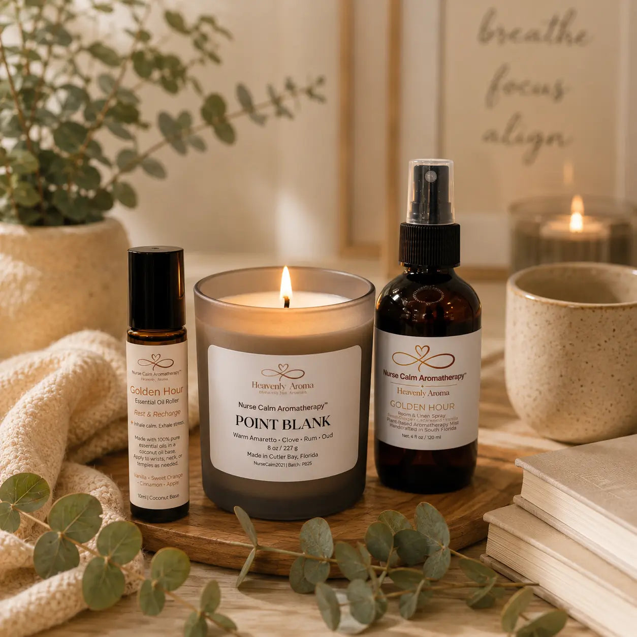Aromatherapy products including a candle, bottles, and a spray bottle on a wooden surface with eucalyptus leaves.