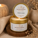 Nurse Calm Aromatherapy candle with 'One Love' label on a wooden coaster.