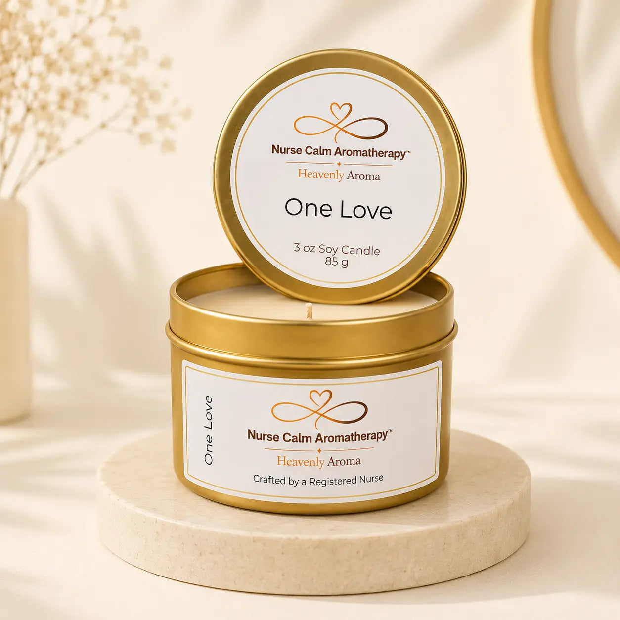 Nurse Calm Aromatherapy candle in a gold tin with 'One Love' label on a beige background