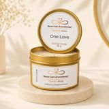 Nurse Calm Aromatherapy candle in a gold tin with 'One Love' label on a beige background