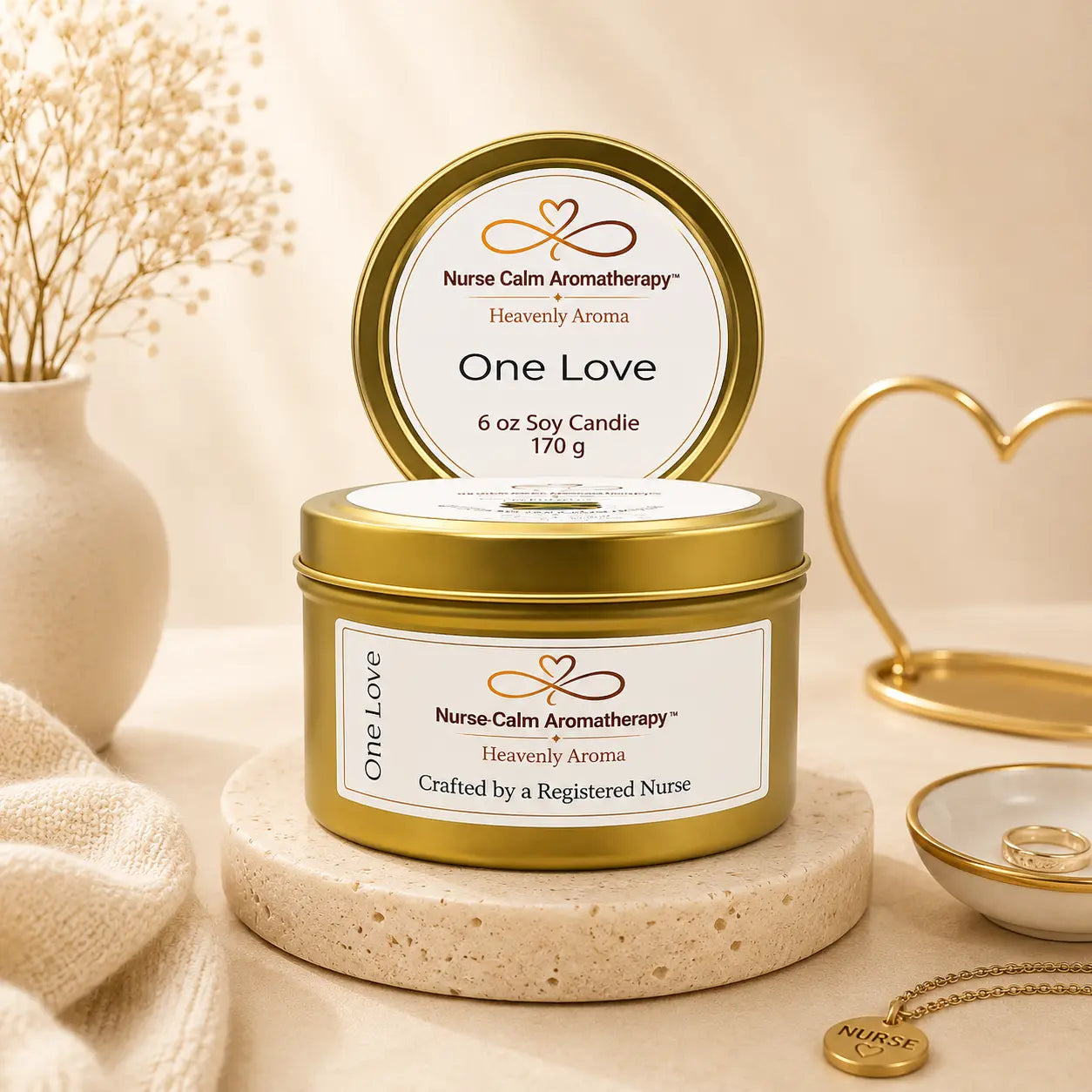 Nurse Calm Aromatherapy 'One Love' candle with gold lid on a neutral background