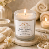Point Blank candle burning on cream spa décor