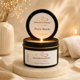 Nurse Calm Aromatherapy candle with a lit flame on a neutral background