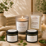 Nurse Calm Aromatherapy candles and packaging on a wooden surface with plants and books in the background.